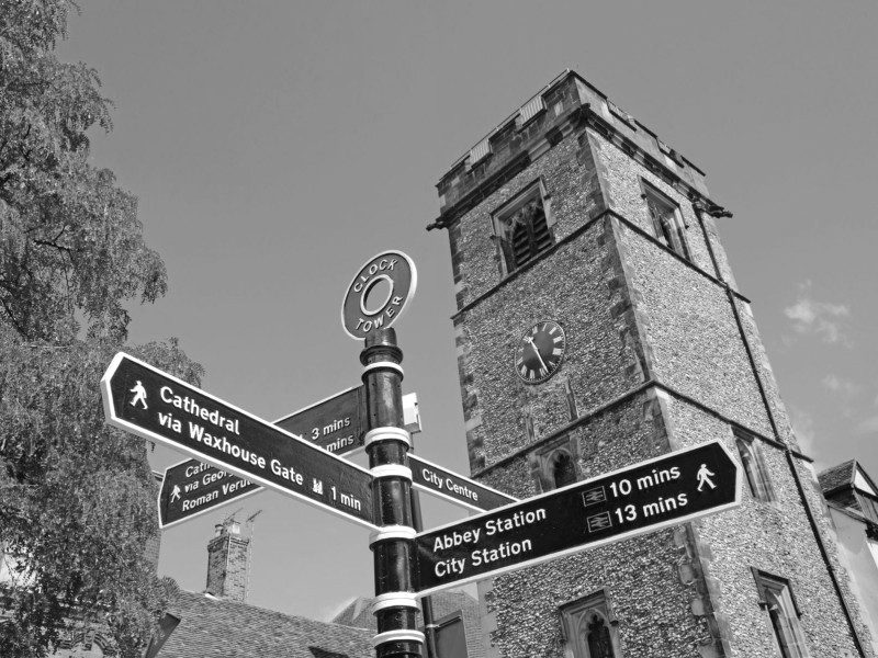 Clock Tower with directional signs in St Albans city centre, St Albans